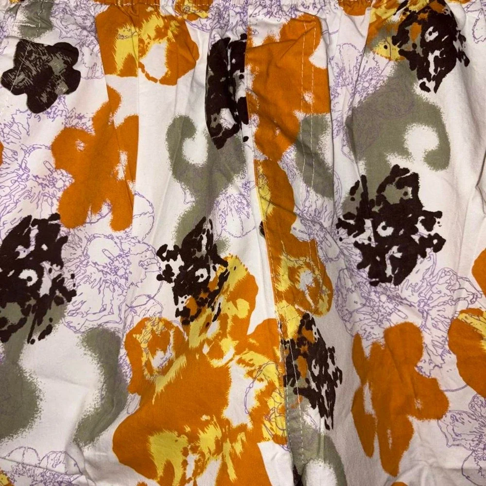 Swim Shorts Orange, black, and purple floral print swim trunks #swimwear #floral